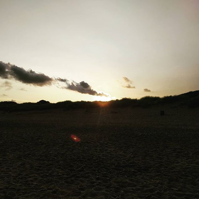 The sun sets over the dunes on the last evening on the beach... We'll miss you Wales!
