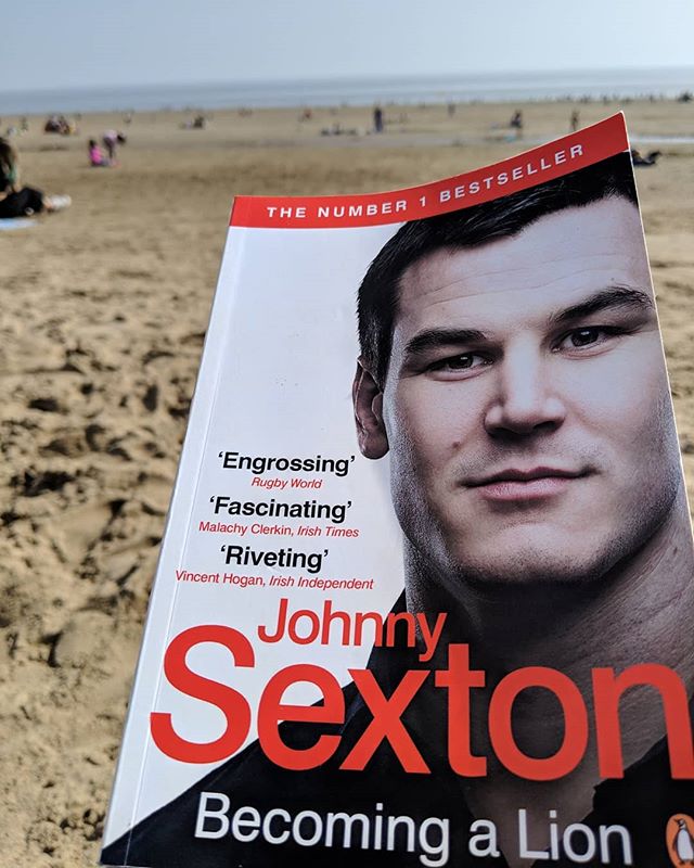 Perfect beach reading, whilst sat on a beach in Wales surrounded by Welsh shirts! @sexton_johnny10 #Barry #irishrugby