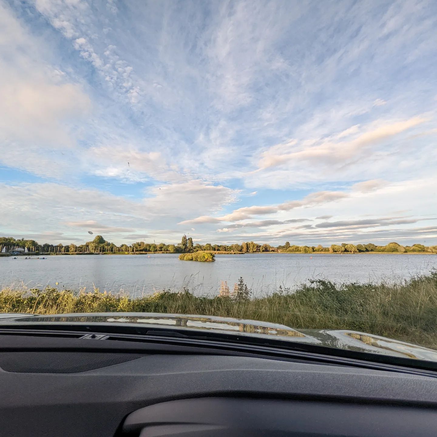 I can think of worse places to spend an evening sat working in the car whilst the young man assists some Scout leaders with their kayaking permit renewal!#scouts #kayaking #scouting #parentlife #cotswoldwaterpark #cotswolds #cotswoldslife #lake #wfh #workingfromhome #laptop #laptoplifestyle